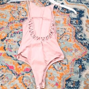 Pink body suit